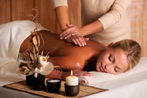 professional masseur doing massage of female back